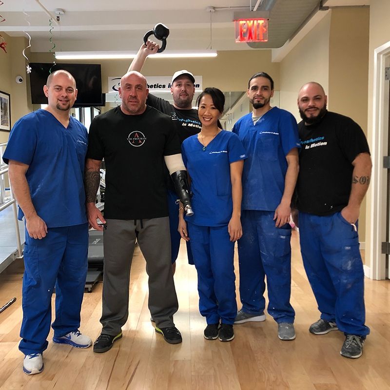 A group of people standing in front of an exit sign
