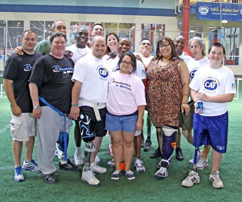 A group of people posing for a picture with one wearing a shirt that says caf