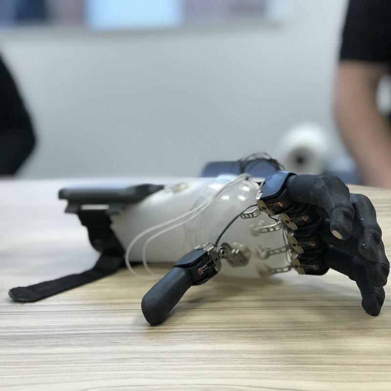 A close up of a prosthetic hand on a table