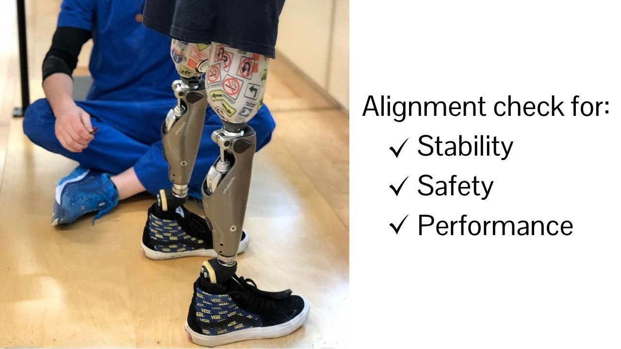 A person being fit for bilateral c-legs.