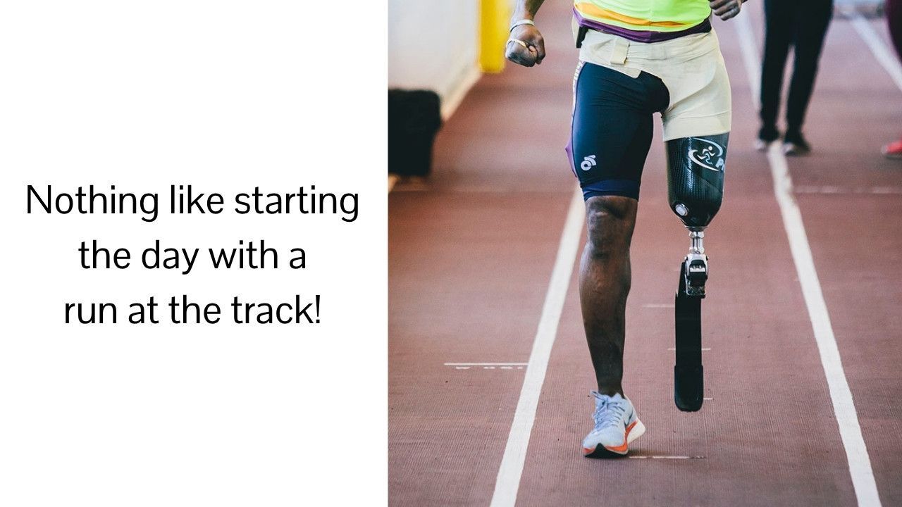 A man with a prosthetic leg is running on a track.