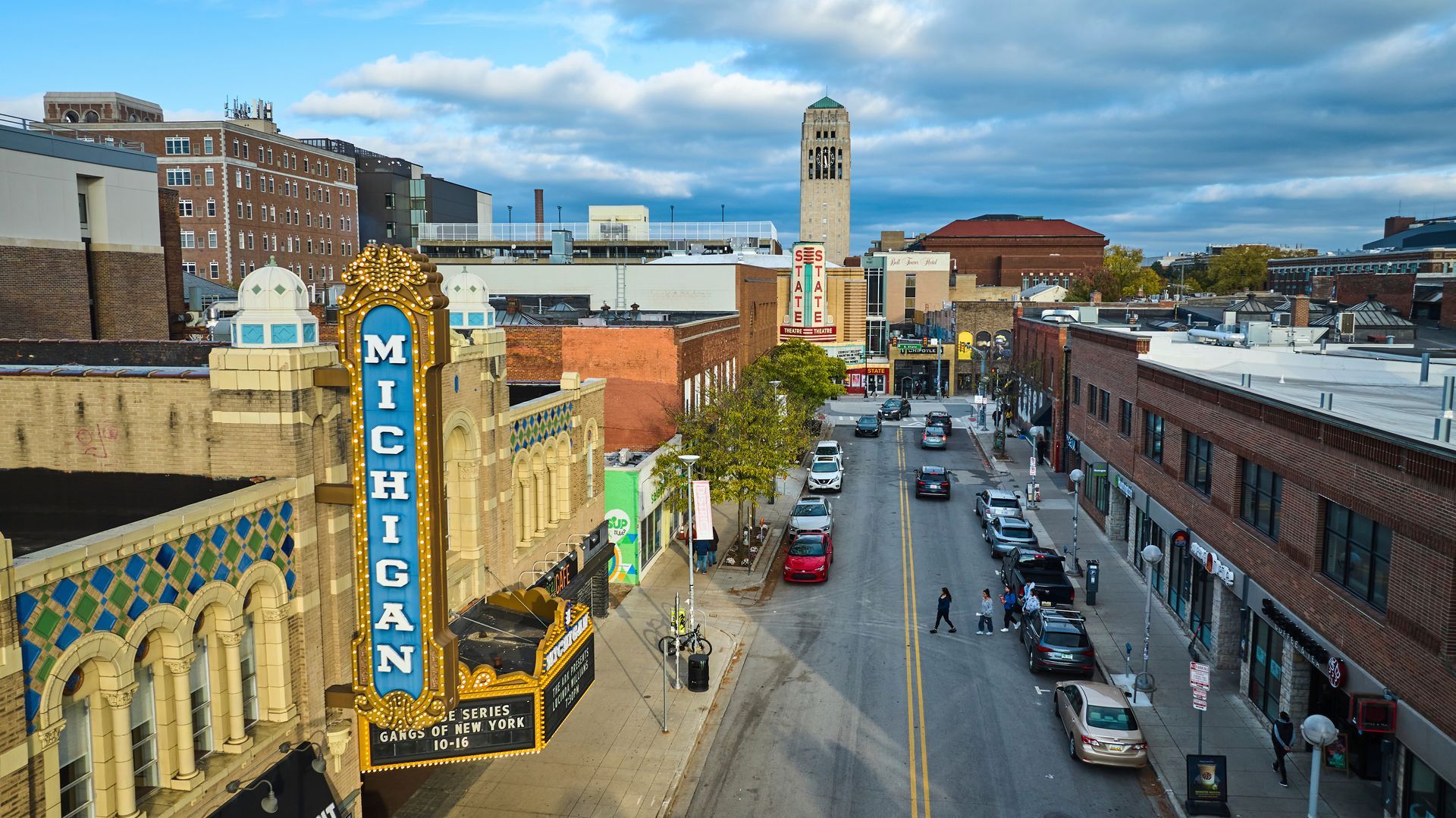 An aerial view of a city street with a michigan theater in the foreground.
