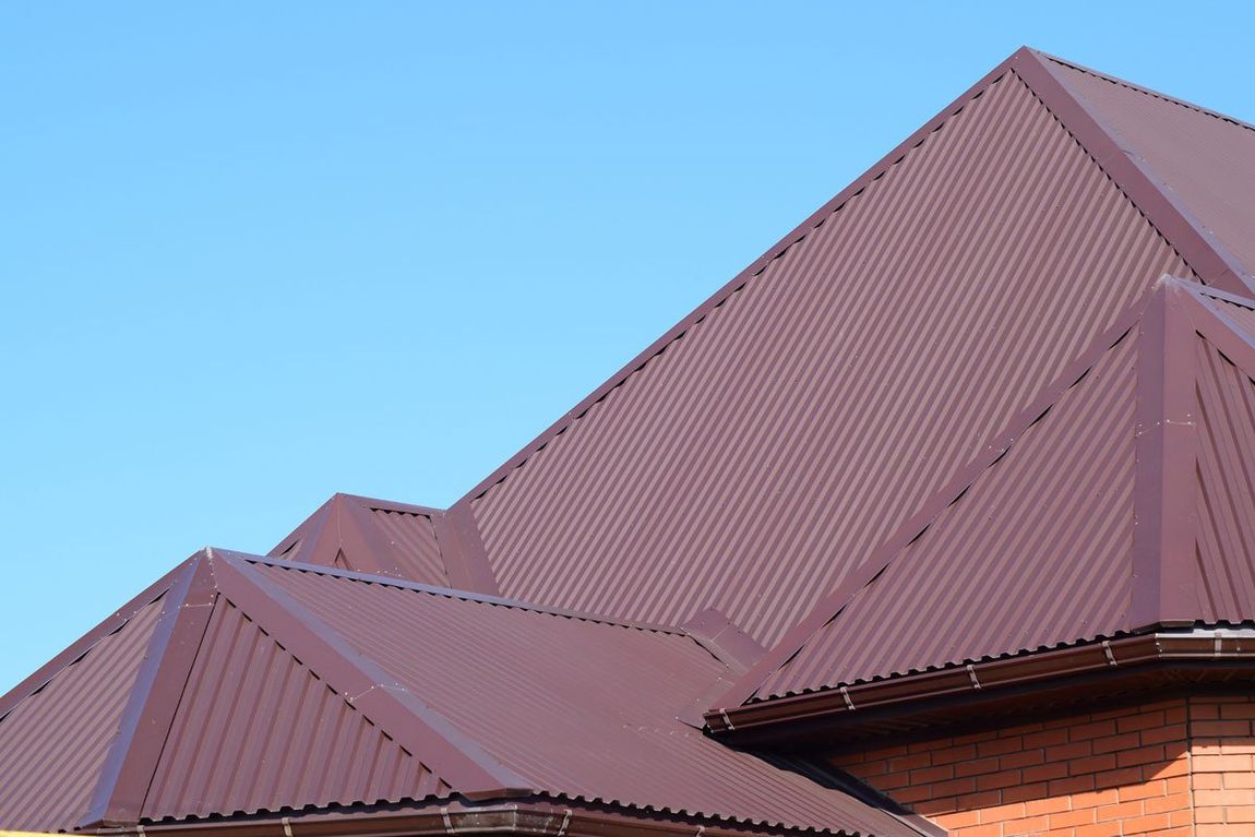 Orange House with red metal roof