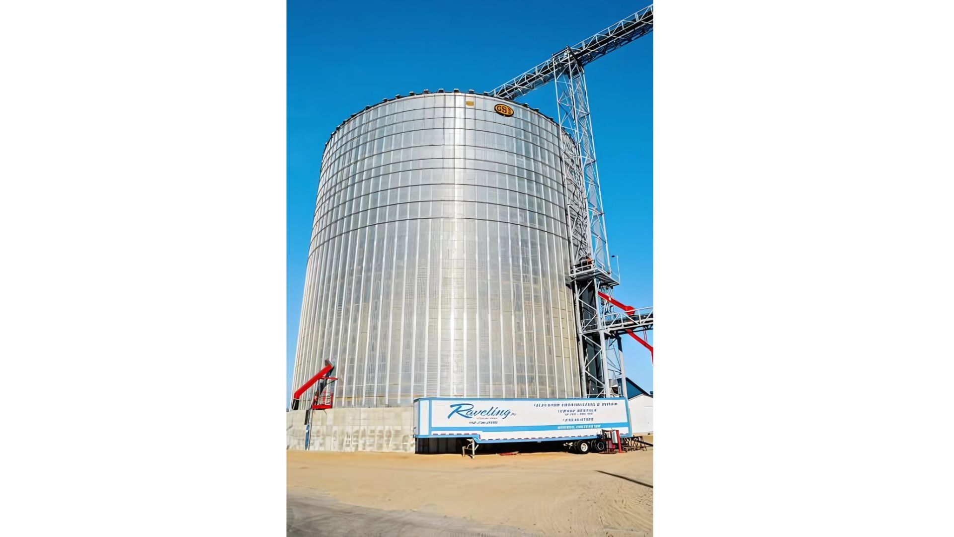 A large building under construction with a truck parked in front of it.