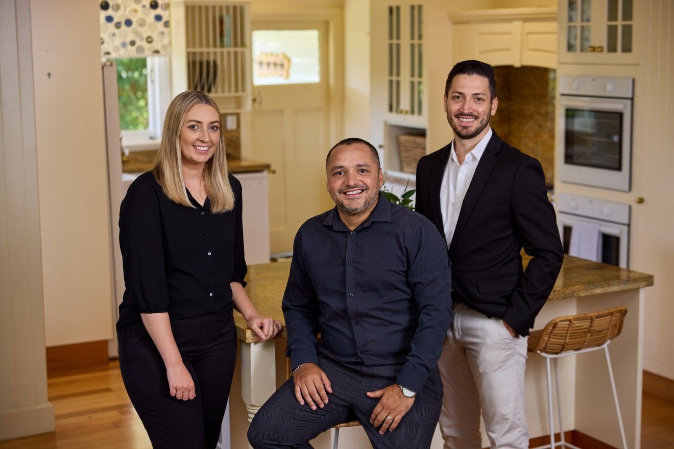 A Group of People Are Posing for a Picture — Loan Select Tablelands in Atherton, QLD