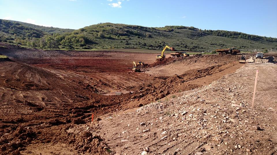 tractor digging in large hole