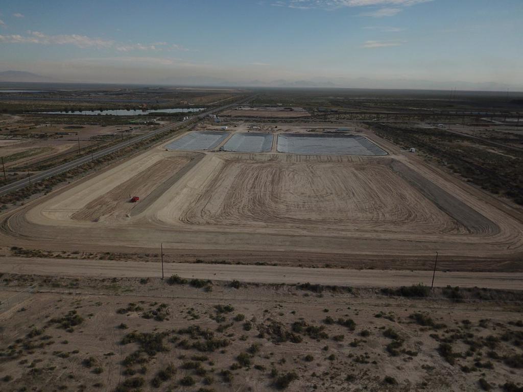 Un-lined area desert with outline of pond-sized hole