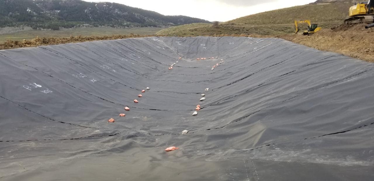 large lake bed lined with black liner