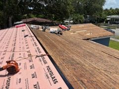 A roof is being installed on a house.