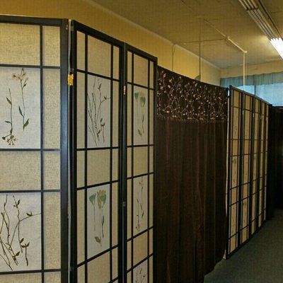 A row of room dividers with flowers on them