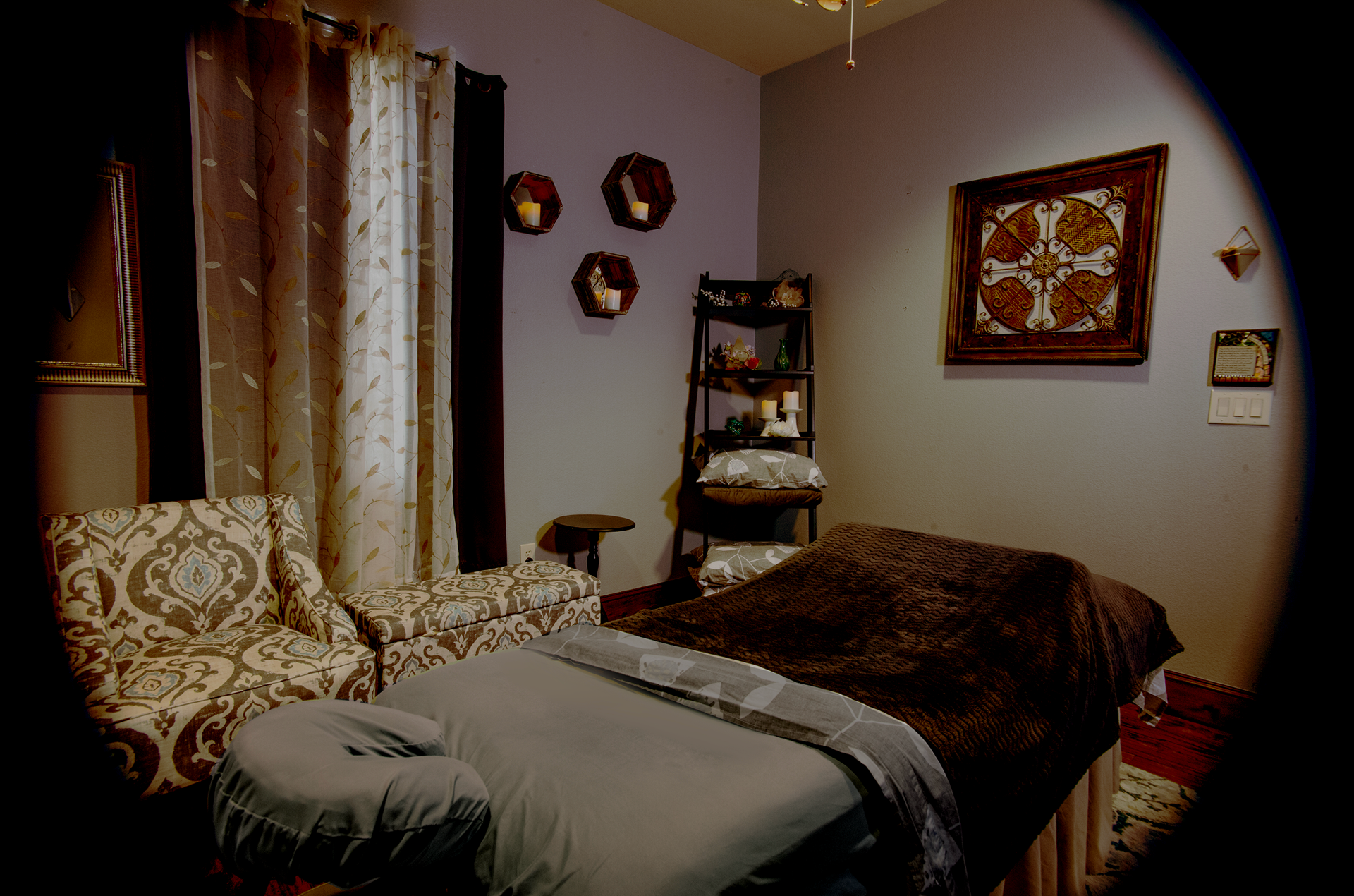 A room with a bed and chairs in it