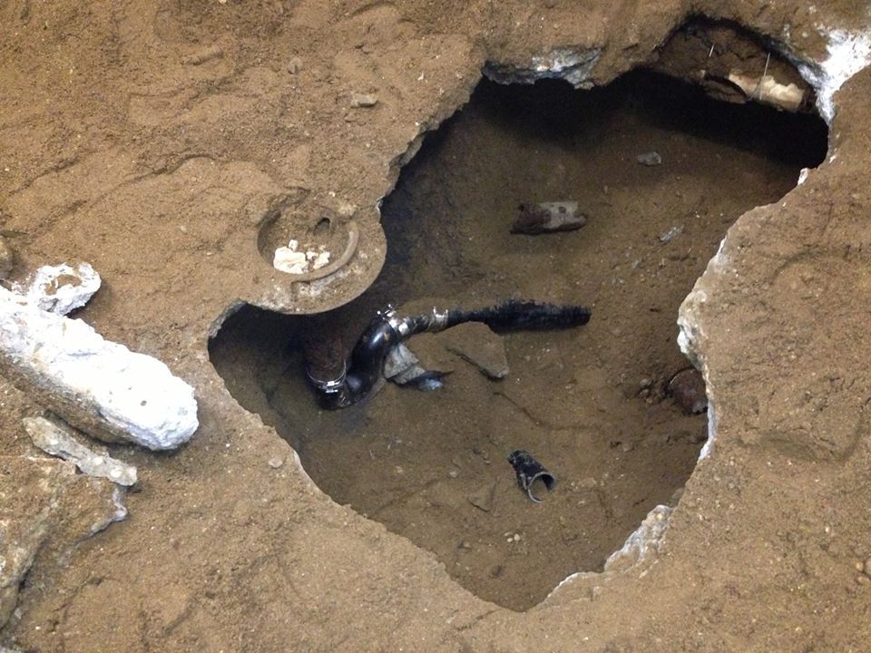 A hole in the ground that looks like a heart