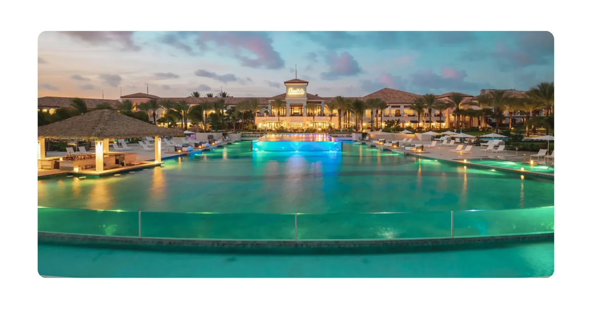 Luxury Sandals resort pool at dusk, after a private boat tour with Maxie Sailing Curacao