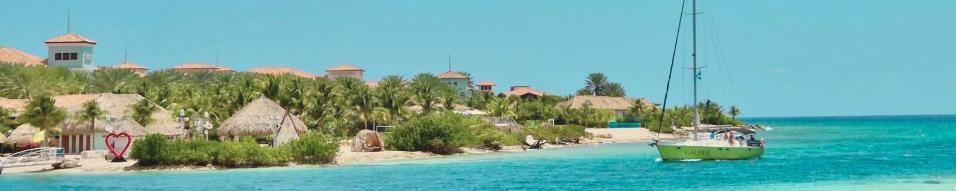 sailing yacht Galaxie cruising in front of Sandals Resort Curacao on a private Maxie Sailing boat trip