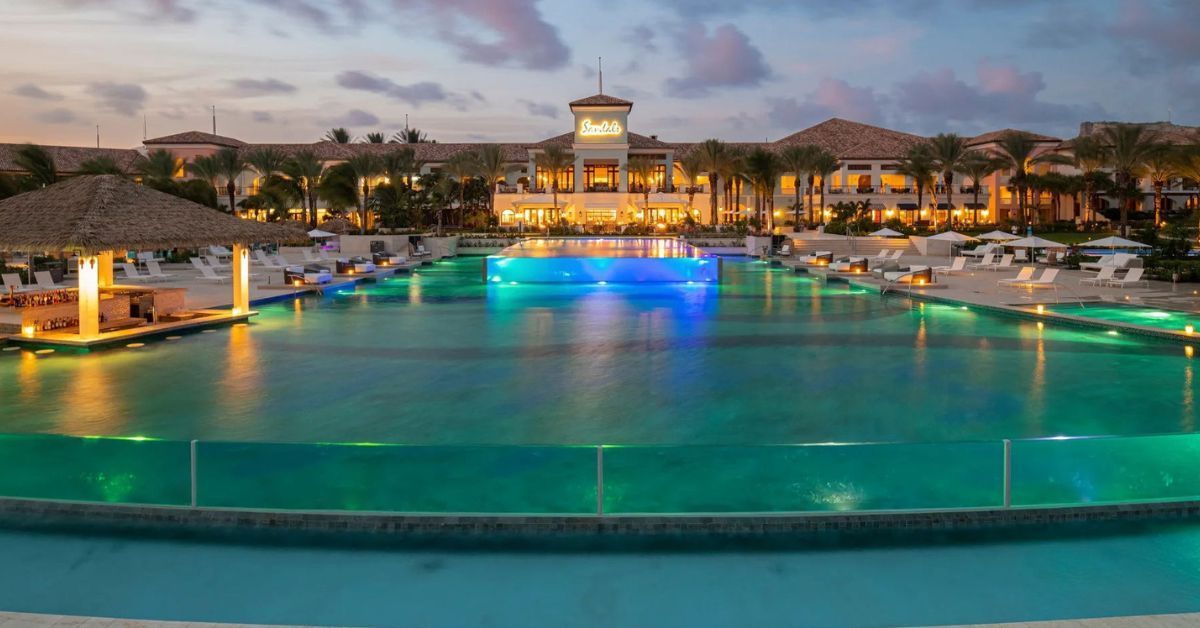 Luxury Sandals resort pool at dusk, after a private boat tour with Maxie Sailing Curacao