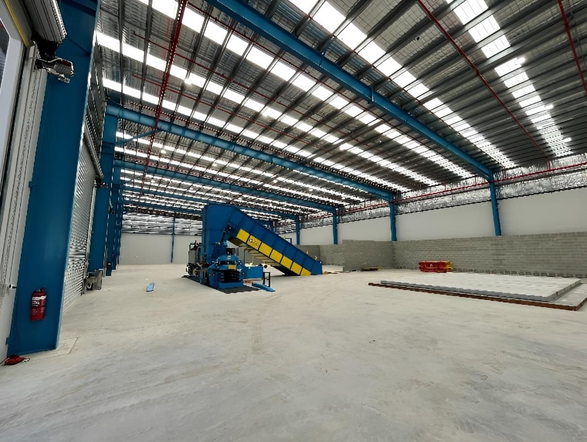 A Construction Worker is Writing on a Clipboard With a Pencil — Construction Services in Tweed Heads, QLD 