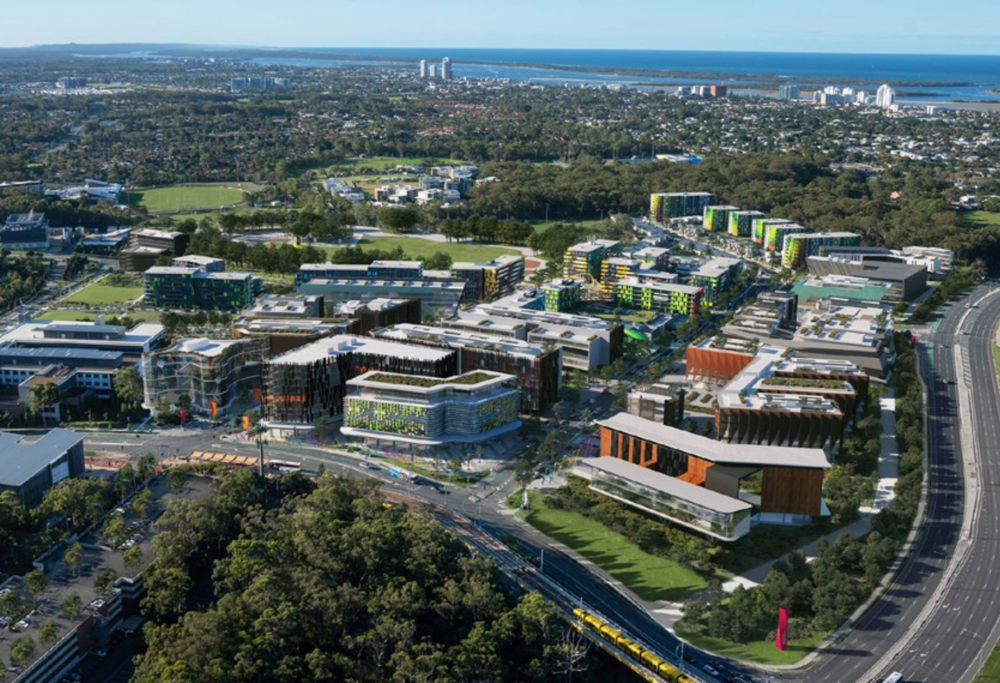Illuminated Tall Building in the City Night Skyline — Construction Services in Southport, QLD