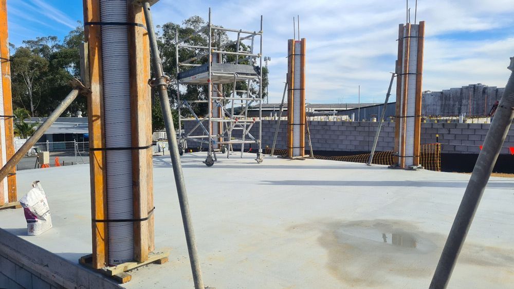 Construction Site with Scaffolding and Poles