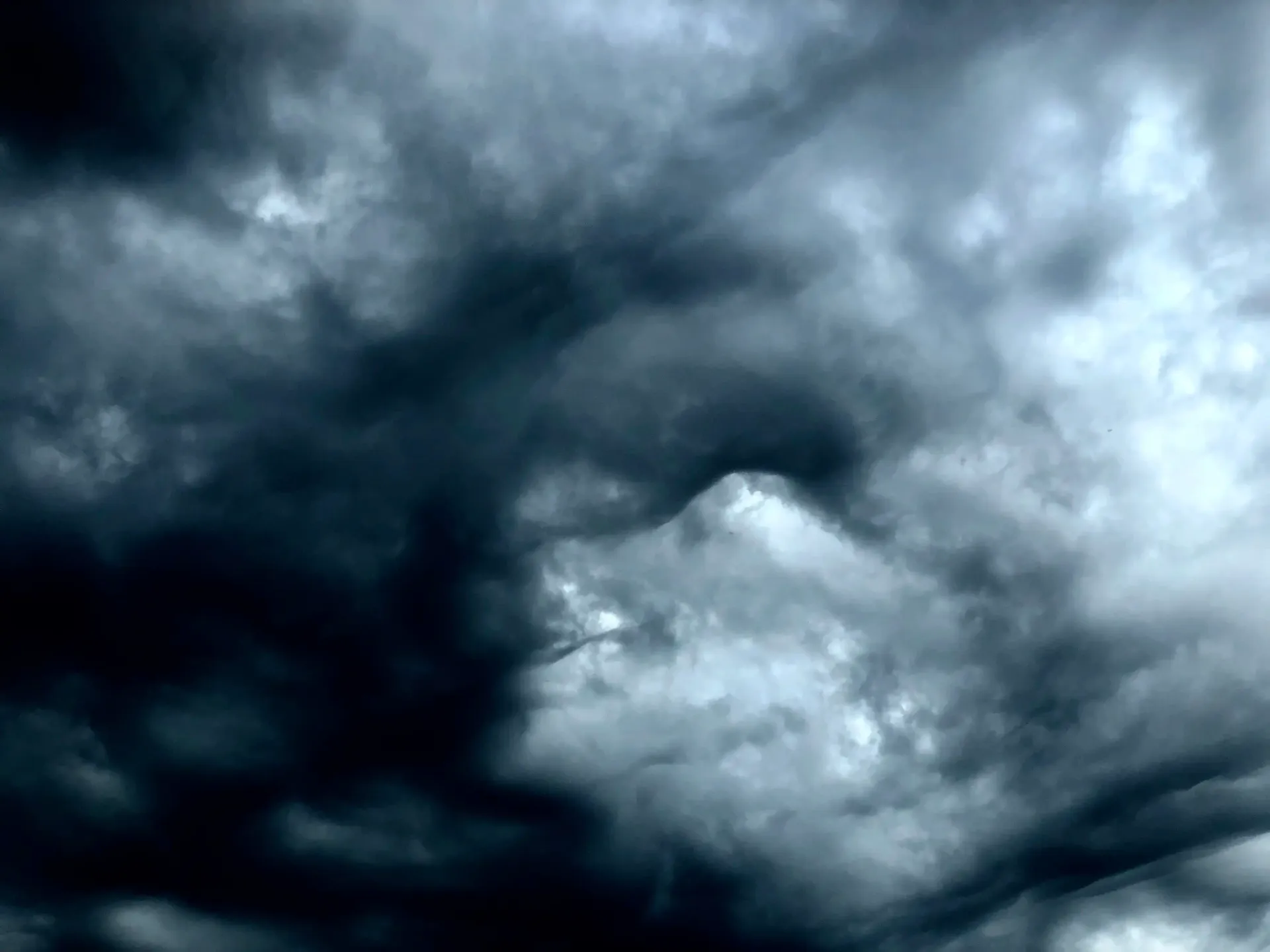 a black and white photo of a cloudy sky
