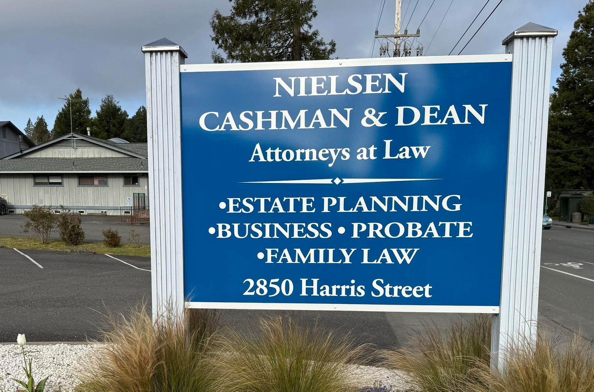 A sign for niel sen cashman & dean attorneys at law