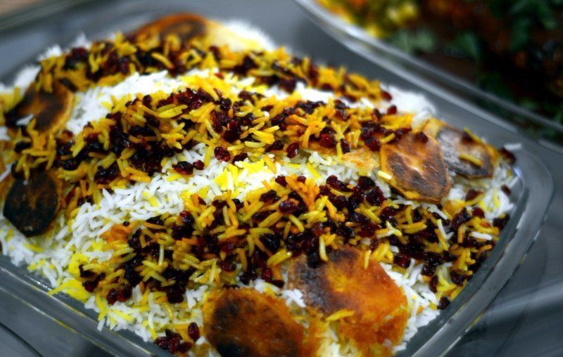 Delicious saffron rice with sour berries, zereshk polo in Persian language