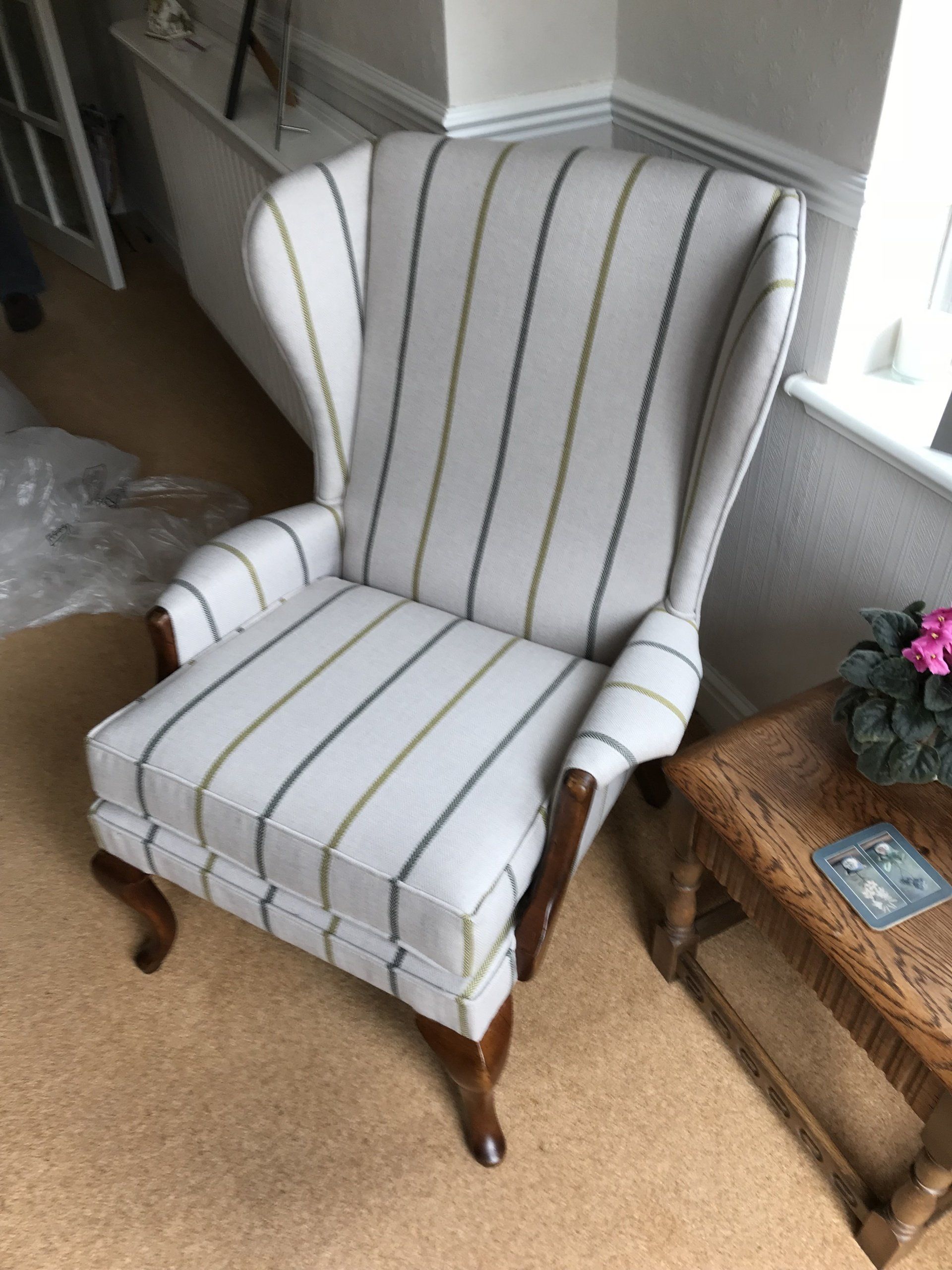 Light coloured striped armchair