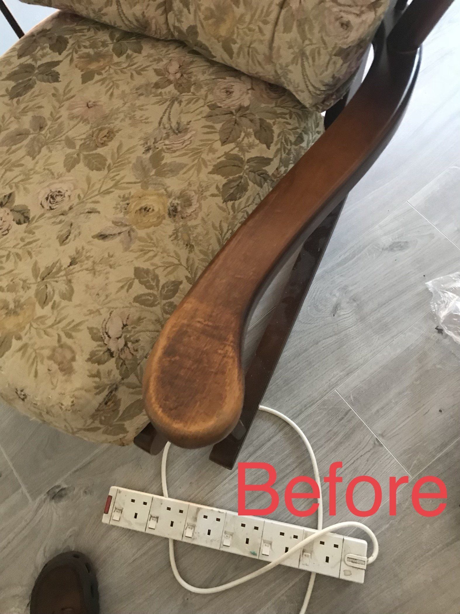 Close up of the wooden arm of a chair