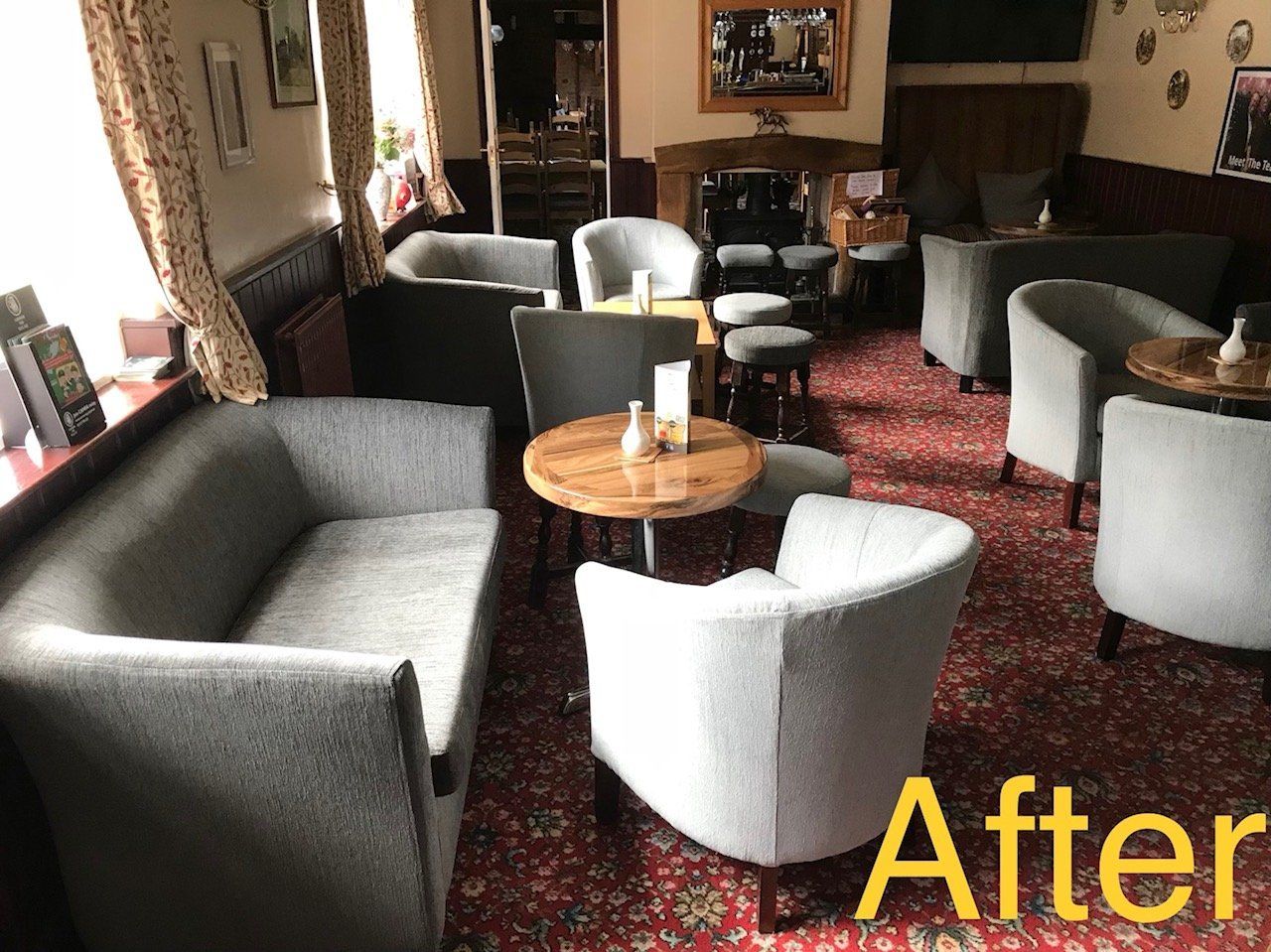 View of the seating in a pub with red carpet