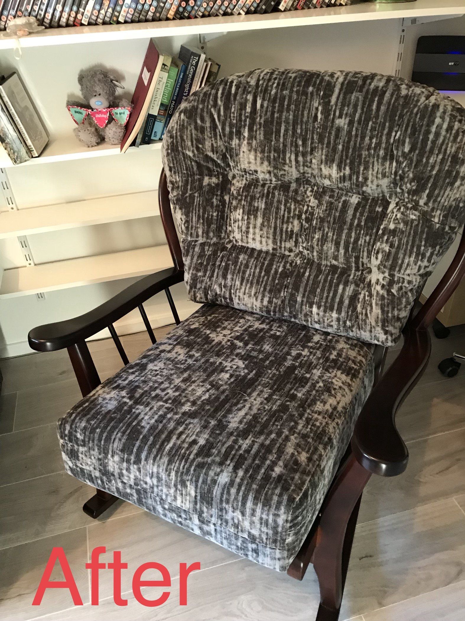 Side angle of a dark patterned chair in a room