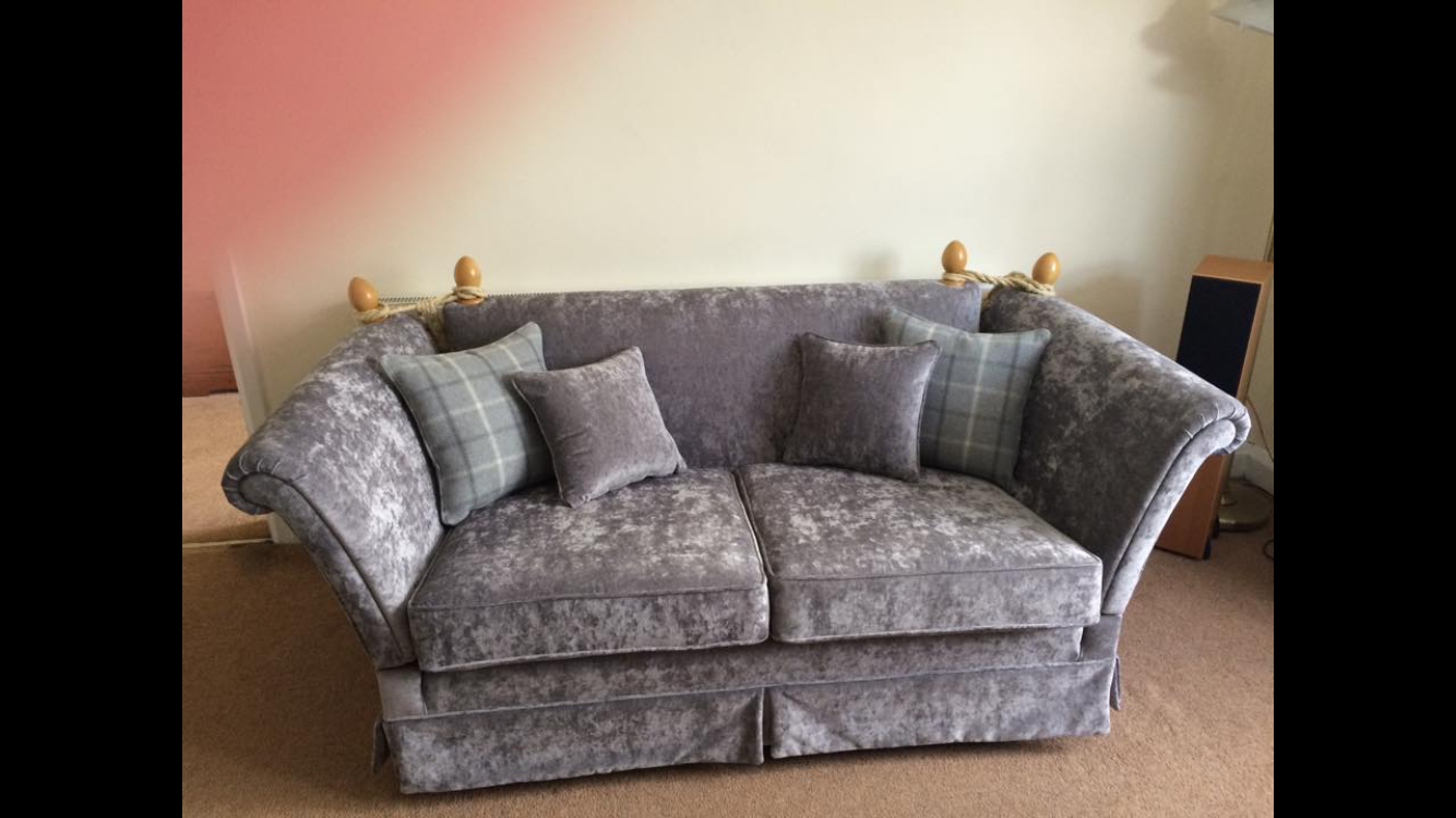 Grey sofa with matching cushions