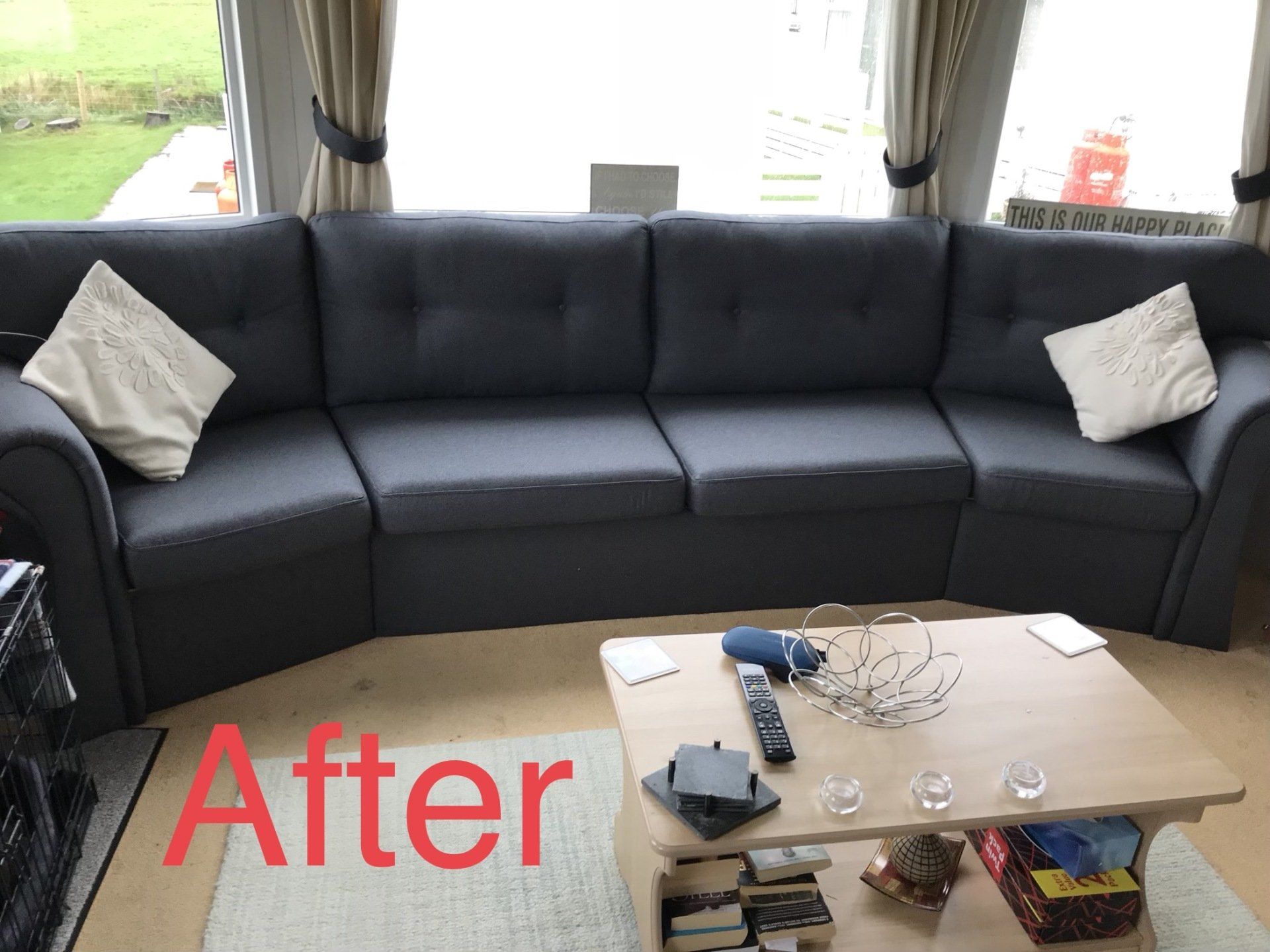 Large black sofa with small coffee table