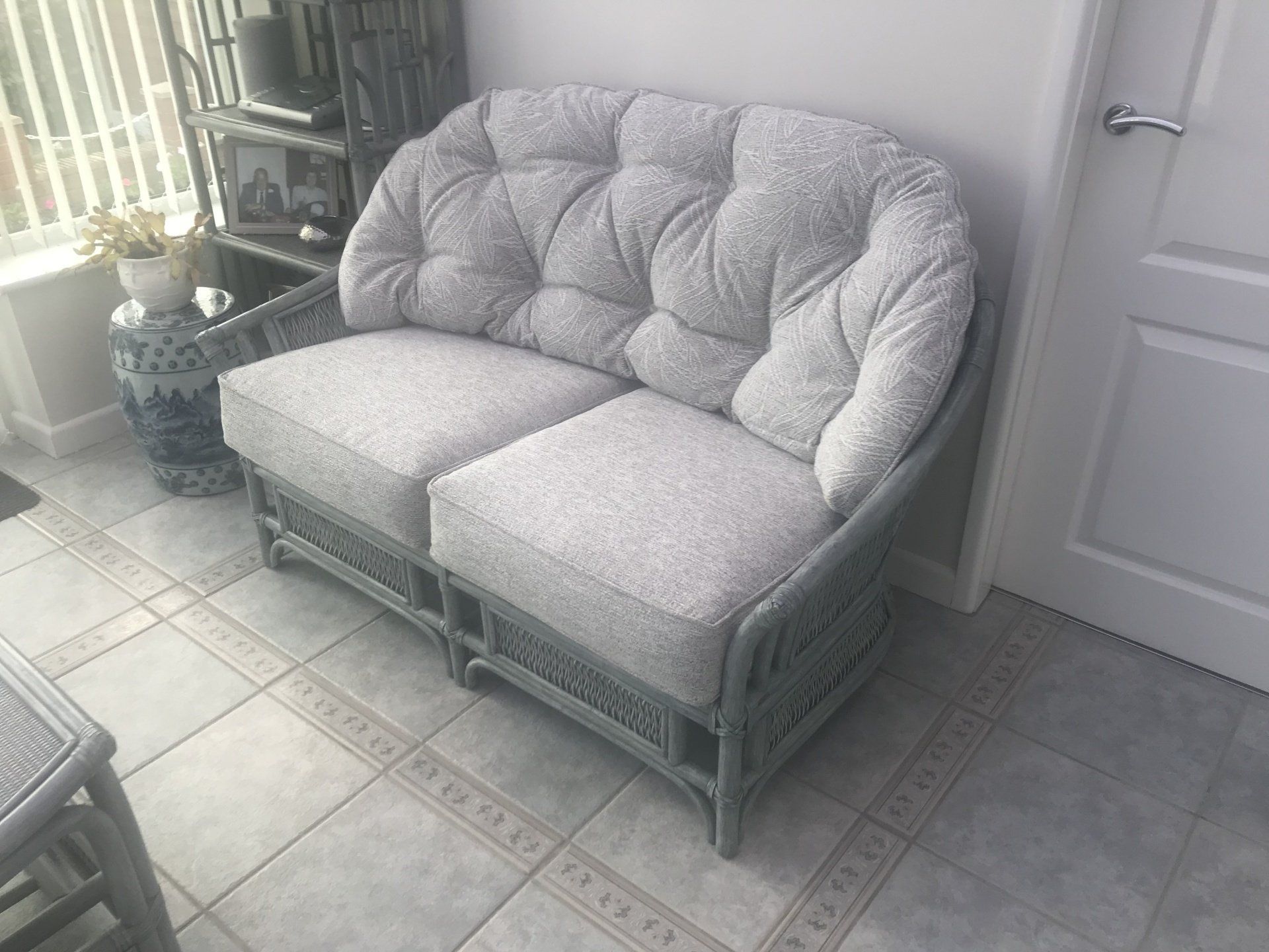Small grey wicker sofa