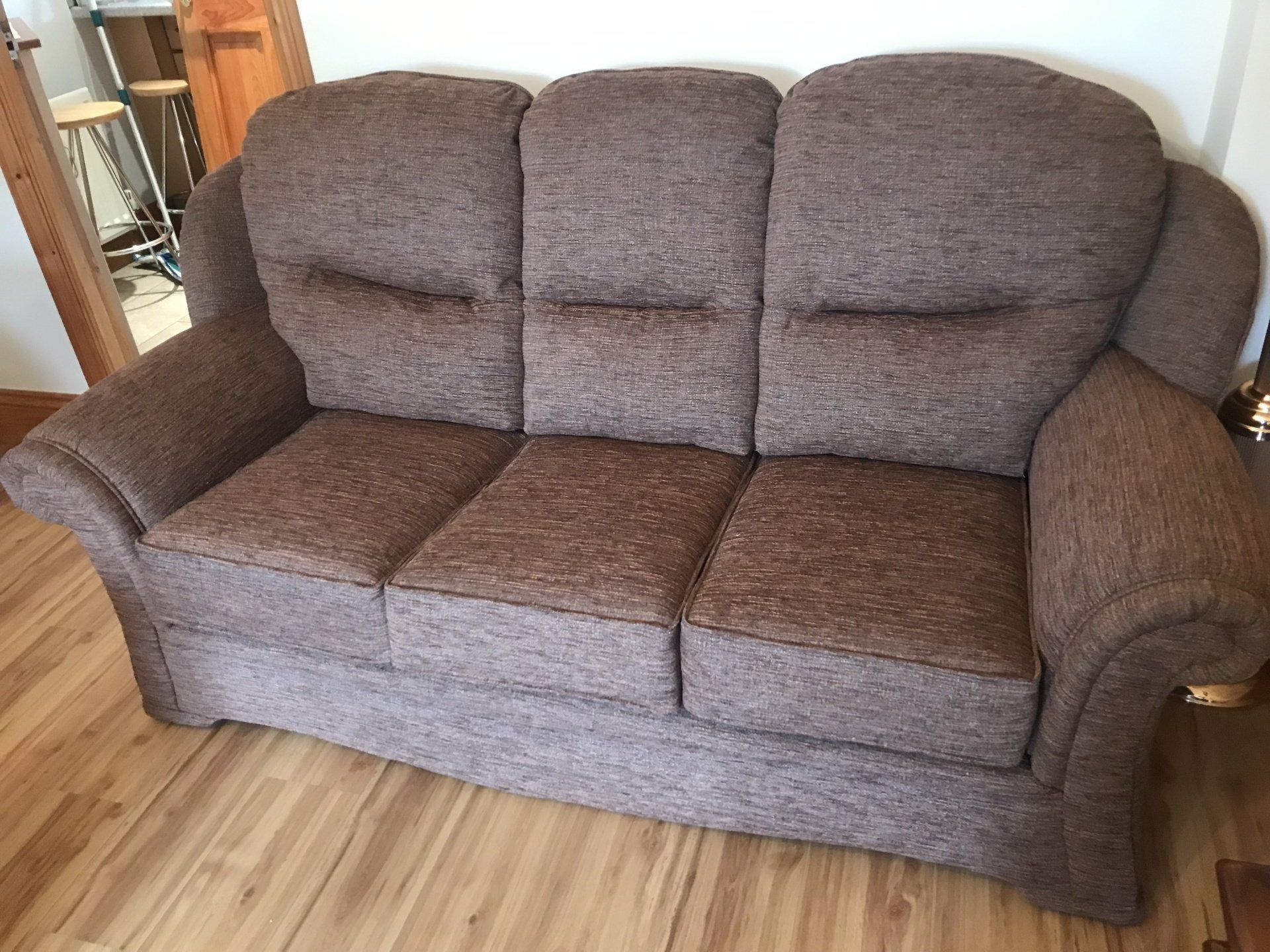 Grey sofa on a wooden floor