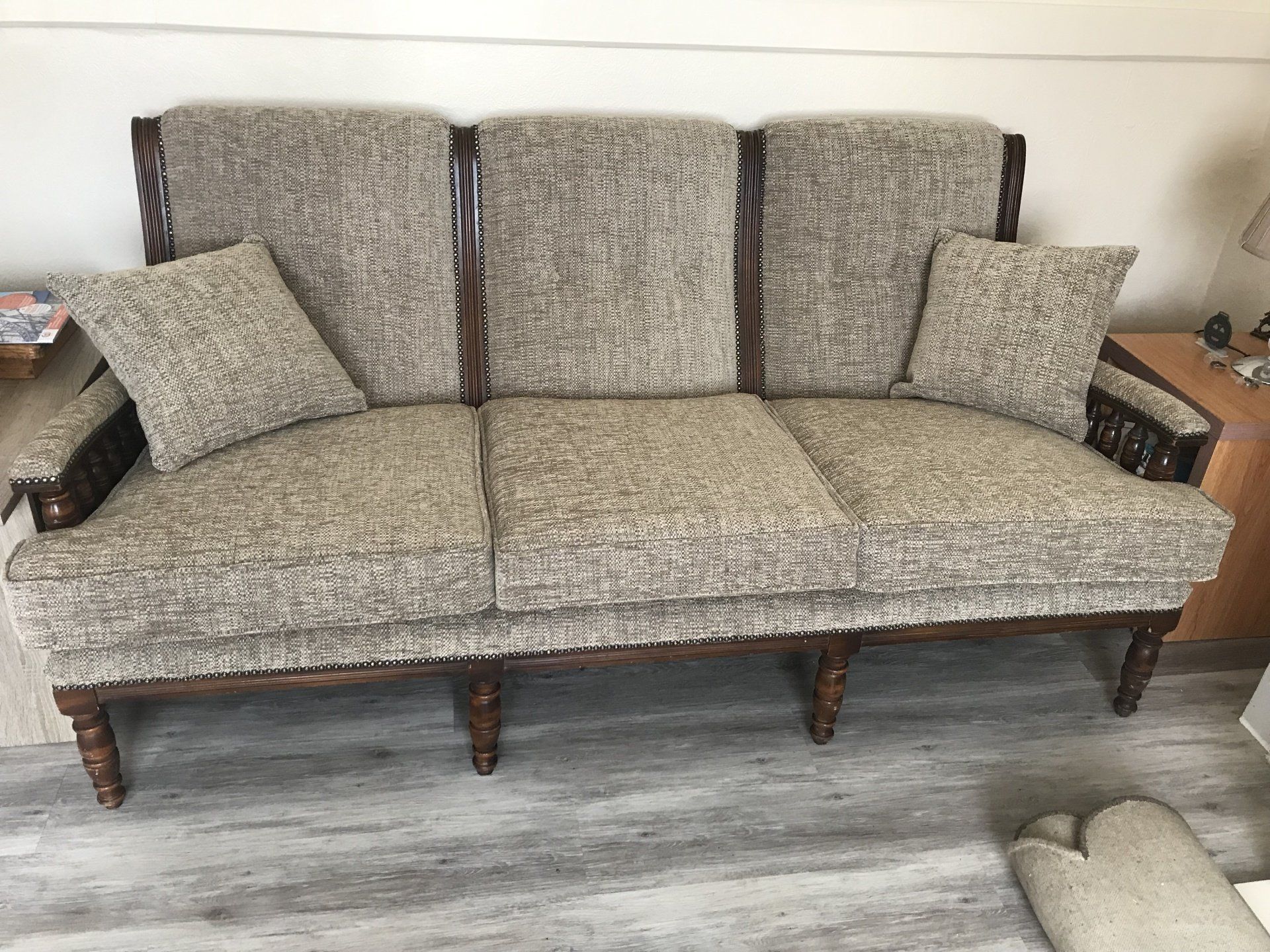 Large grey sofa with wooden legs