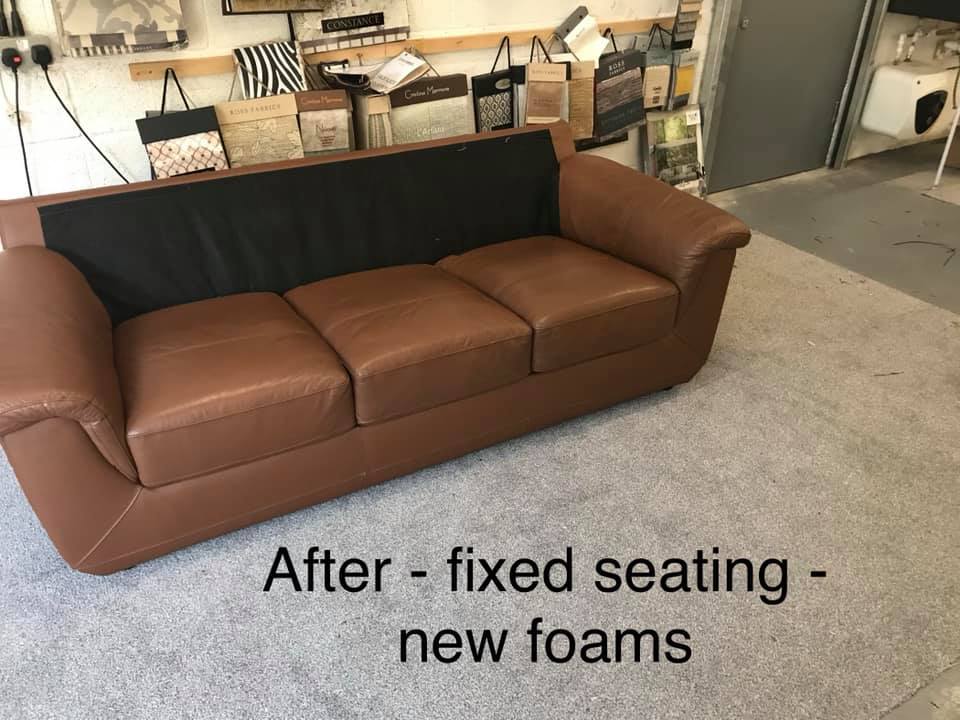 Upholstered brown leather sofa in a workshop