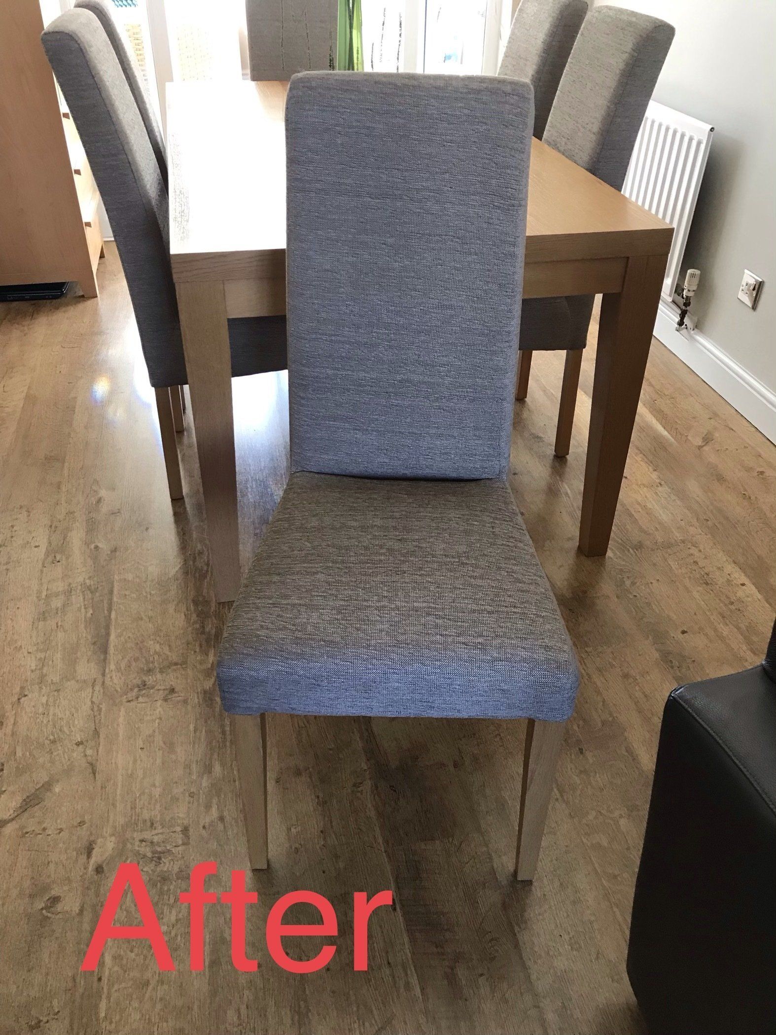 Blue dining room chair with table in the background