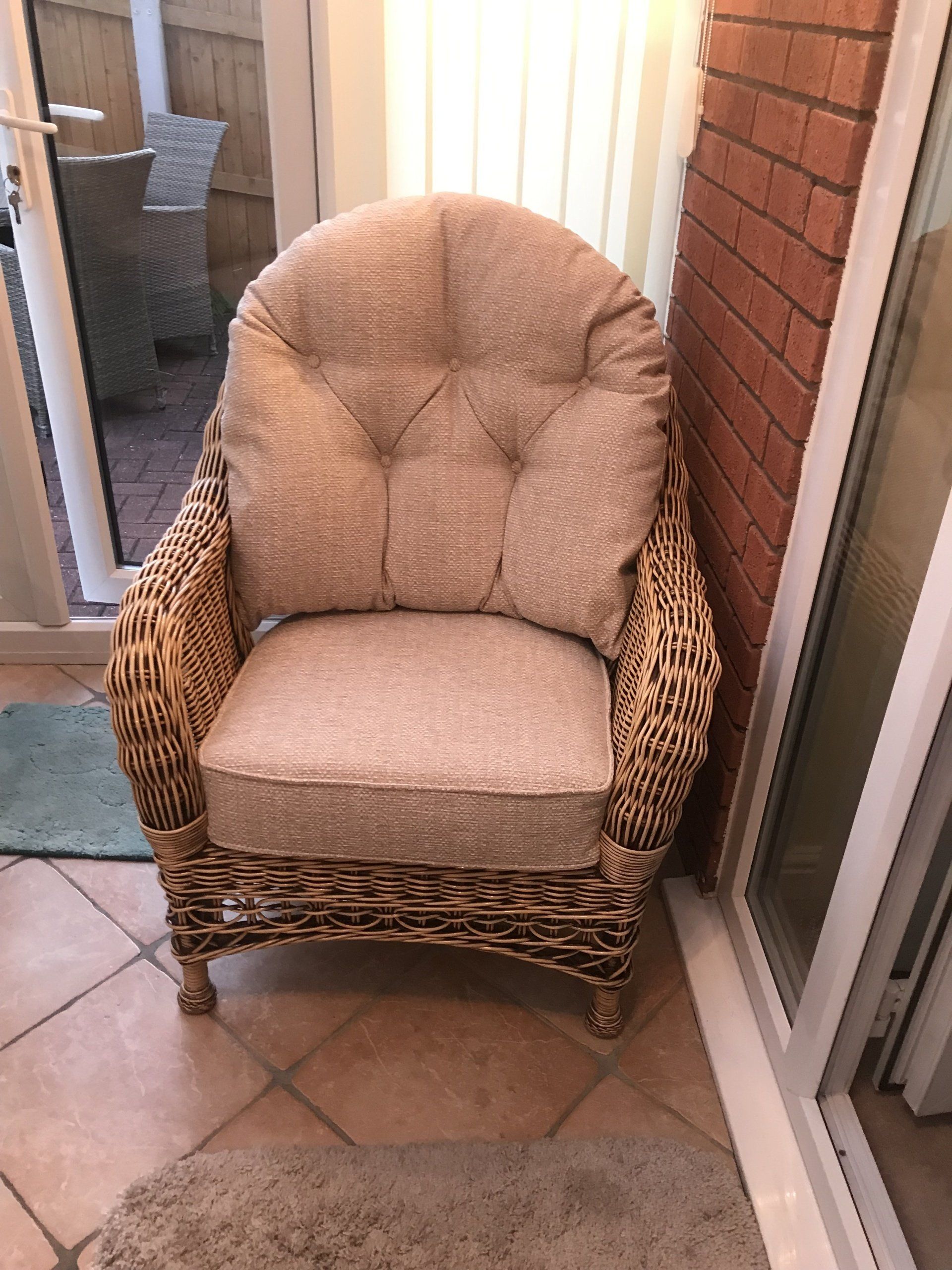 Pink wicker armchair