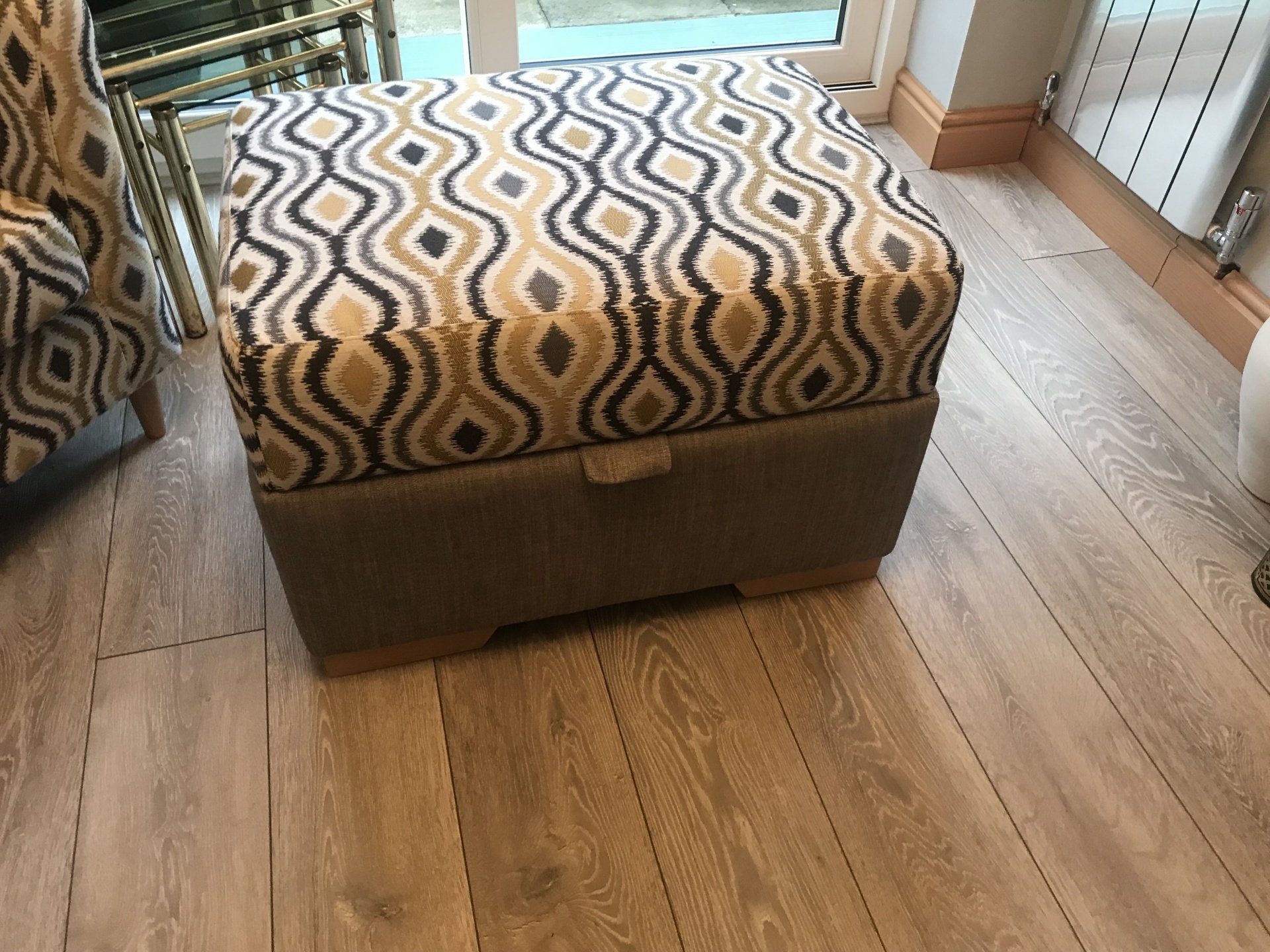 A closed storage box with a patterned fabric lid