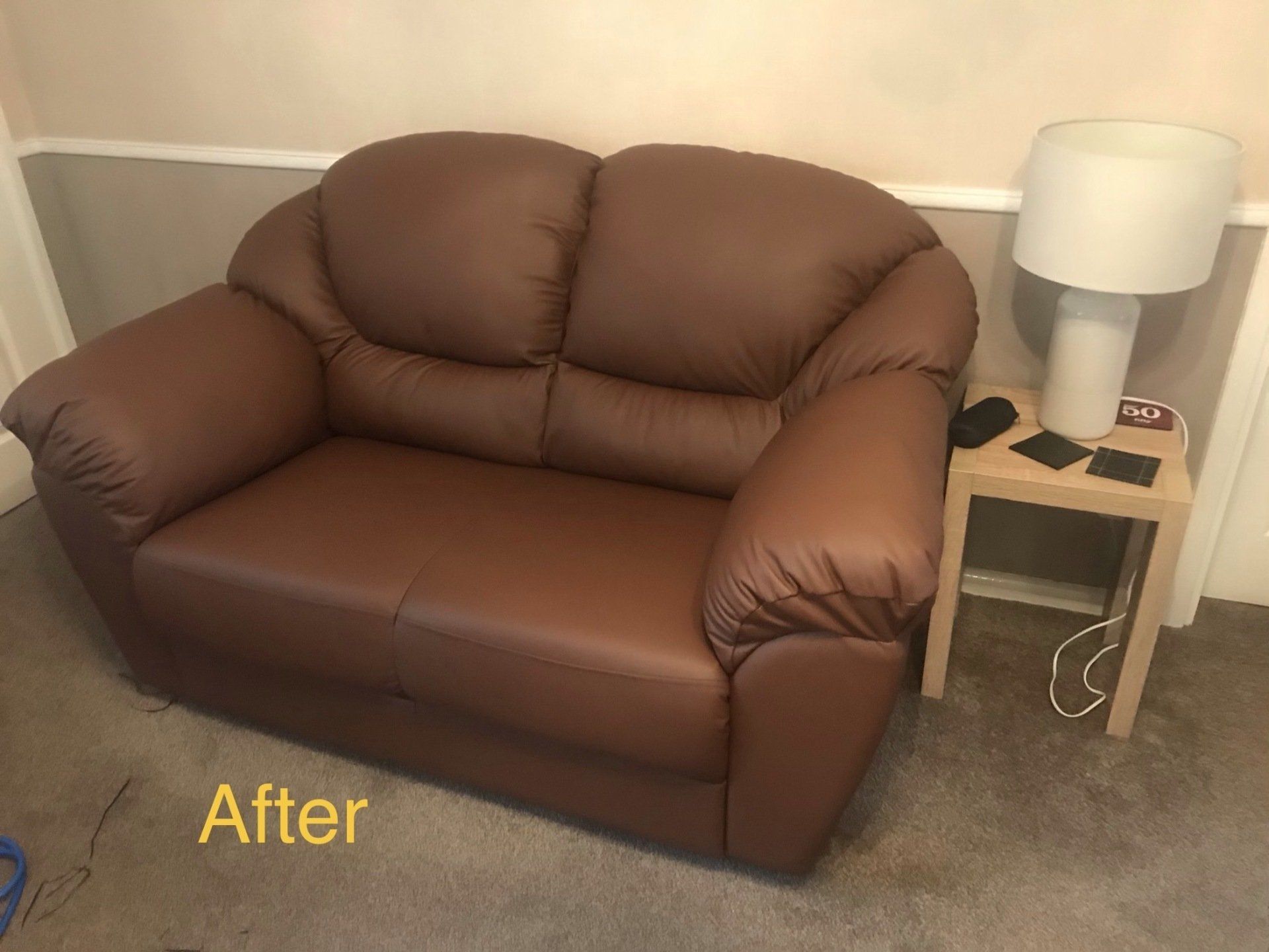 Small brown leather sofa