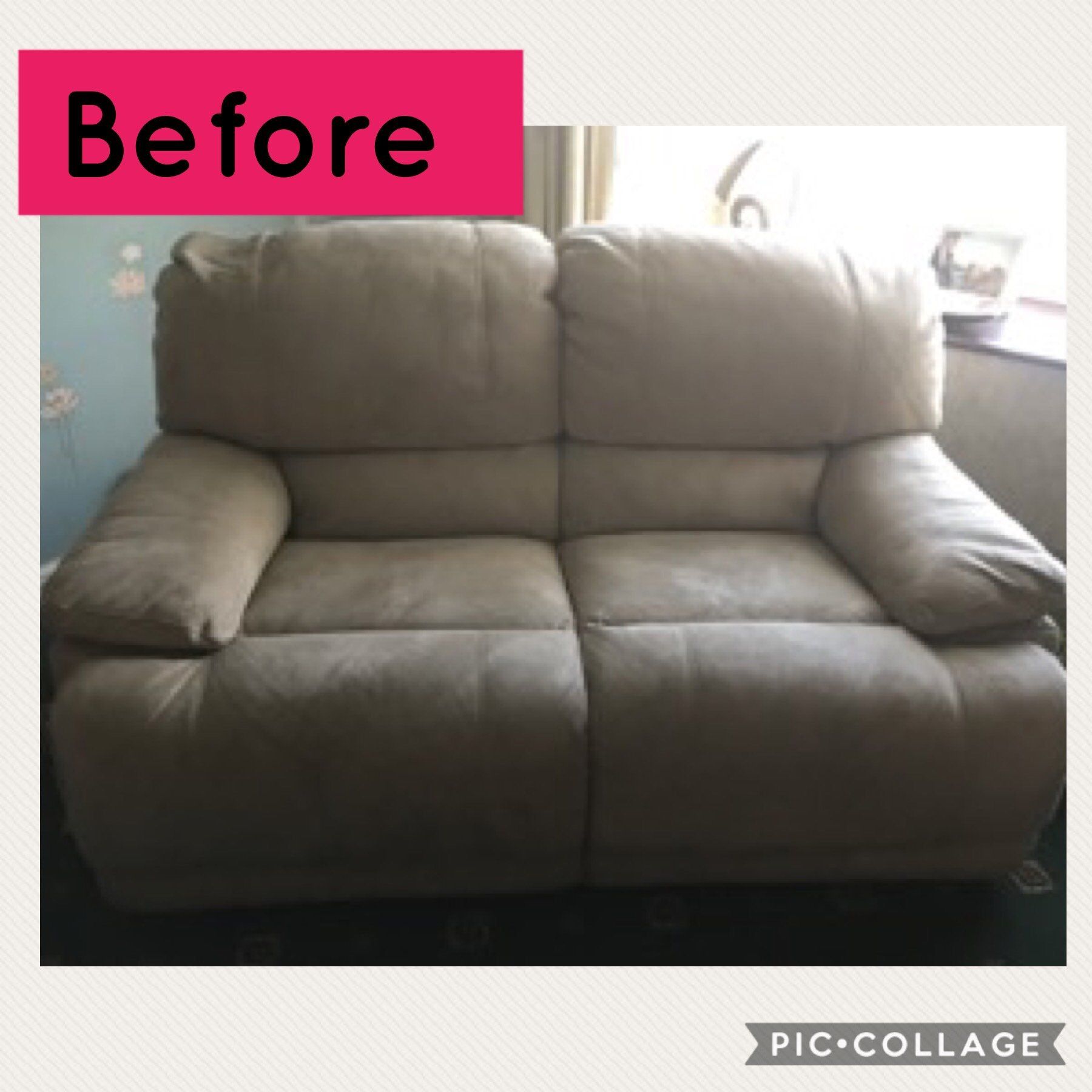 A small grey sofa by a window