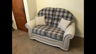 Small blue and white check patterned sofa with cushions