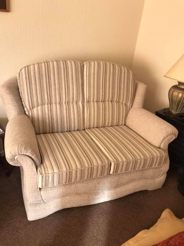 A cream coloured striped armchair