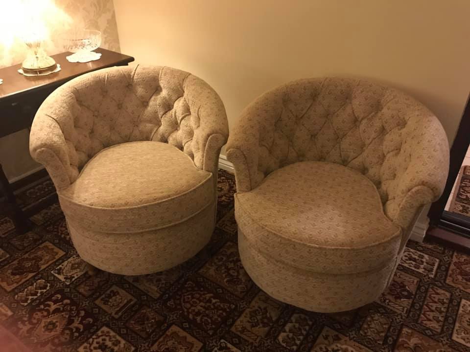 Two beige round bucket chairs
