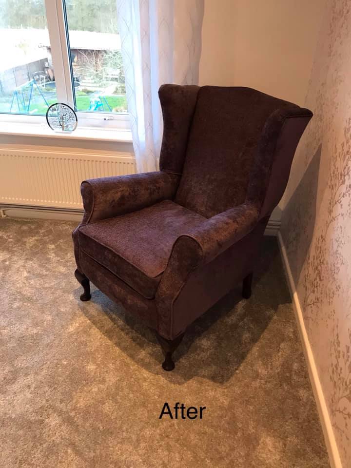 Side view of brown wooden armchair