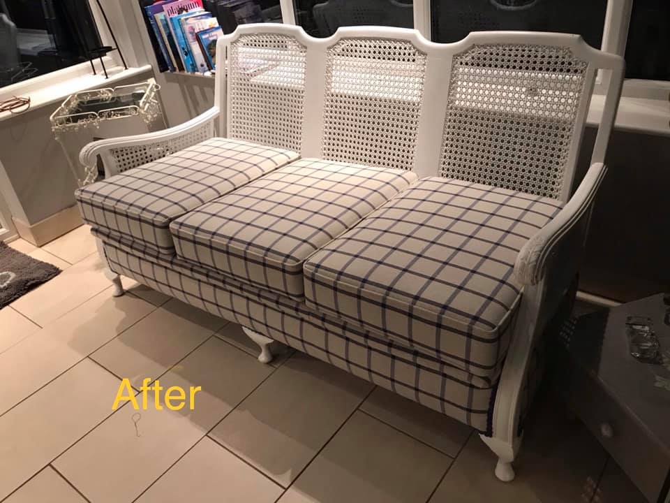 White sofa with blue and white patterned upholstery