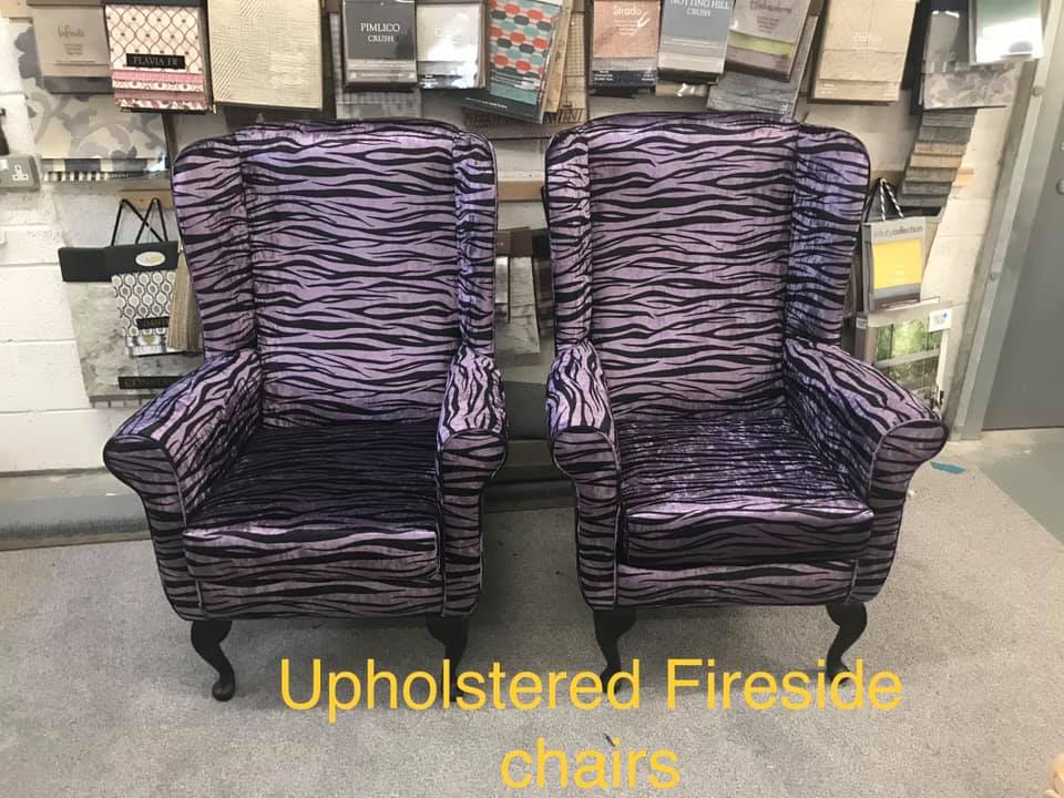 Two matching purple zebra print armchairs