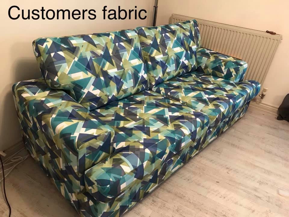 Sofa with a bold blue and green geometrically patterned upholstery