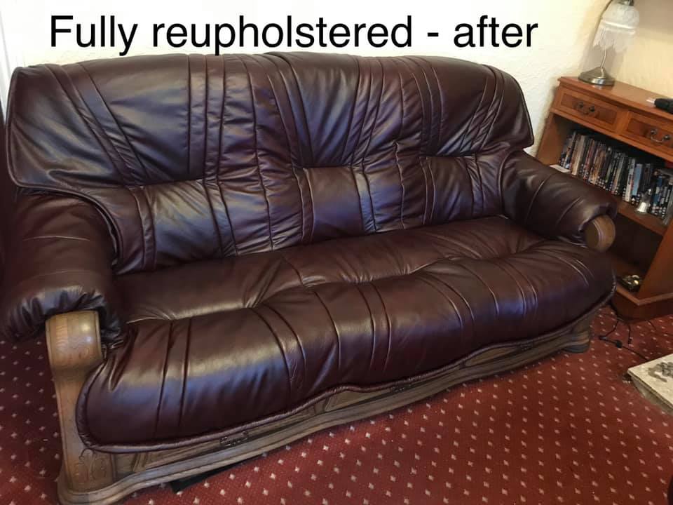 Large brown leather sofa with red carpet