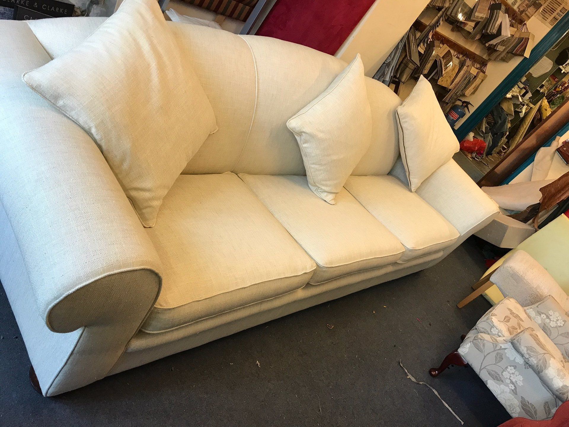 White sofa with matching cushions