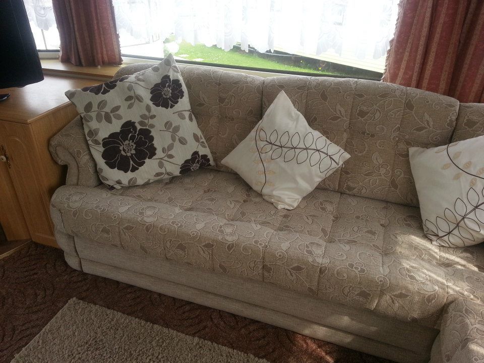 Neutral coloured sofa with cushions